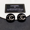 Chanel Black Resin Circle Earrings - 18K Yellow Gold
